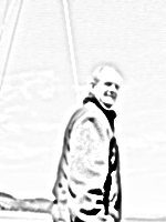 This is my father in his boat. (When we were sailing.)