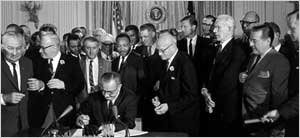 <a href=http://www1.cuny.edu/portal_ur/content/voting_cal/photos/lyndon_baines.jpg>LBJ signing the Civil Rights Act</a>