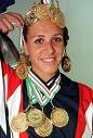 <a href=http://weekly.ahram.org.eg/1999/445/fro2.jpg> Holding her medals</a>