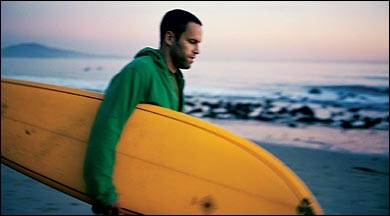<a href=http://away.com/images/outside/200503/disp-jack-johnson.jpg>Jack Johnson with his surf board </a>