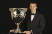 Sebastien posing with the Champ Car trophy (http://www.champcarworldseries.com/)