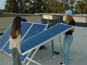 <a href=http://www.nohum.k12.ca.us/ahs/ebridge/images/uploads/larmin/solar.JPG>Installing solar panels</a>
