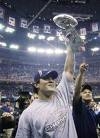 Tedy holding up the championship trophy. (Google Images)