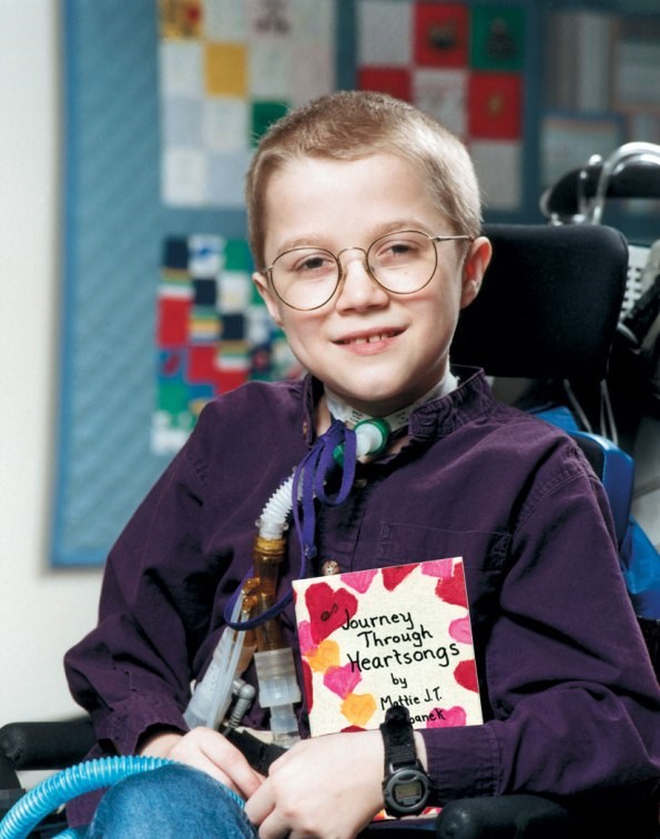 Mattie and one of his books (http://www.mda.org/mattie/mattie_book.jpg)