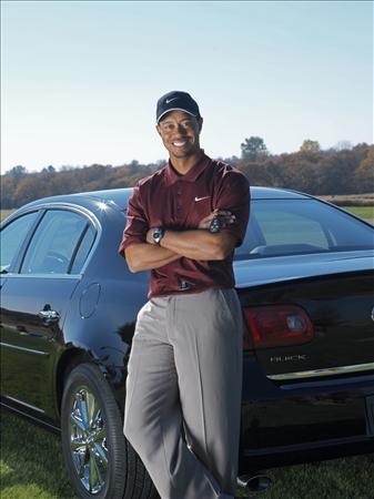 Tiger woods after give  money (http://www.autoblog.com/media/2006/04/tiger-woods-with-buick-resized.jpg)