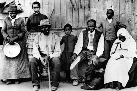 Harriet Tubman with a group of slaves she assiste (www.greece.k12.ny.us)
