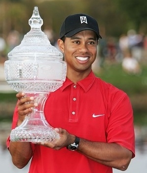 Tiger holding the Buick Open trophy (www.businessweek.com)