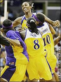 Getting hugs from her teammates. (sports.espn.go.com)