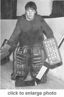 This is Karen Koch posing with her goalie gear. (http://www.marquetteironrangers.com/kar.htm)