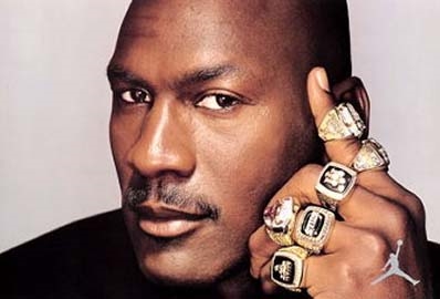 Michael Jordan with Championship Rings (upperdeckblogs.wordpress.com)