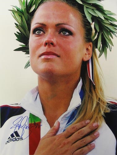 In Athens, Greece, after they won the gold metal  (http://www.celestialsphere.us/images/508/JENNIE%20FINCH%20PHOTO.jpg)