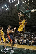 Kobe Bryant shoots a slam dunk against a Golden S (http://en.wikipedia.org/wiki/Kobe_Bryant)