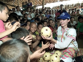 Jolie handing out toys in Cambodia. (http://www.solcomhouse.com/images/JolieField.jpg)
