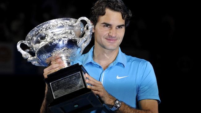 Roger with the trophy from the win of the 2010 Au (Google Images)