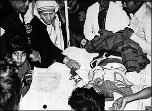 Mother Teresa helping  the sick