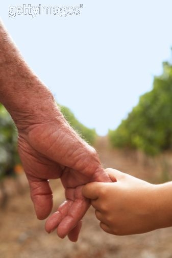 A grandpa and grandaughter holding hands (www.google.com/pictures/grandfather and grandaughter holding hands)