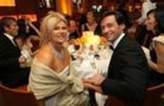 With his wife (http://www.mtime.com/group/style/discussion/581513/)