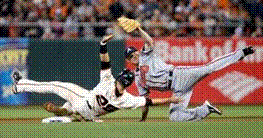 buster posey sliding into second base (http://www.walkoffwalk.com/2010/10/buster-posey-steals-second-bas.html)