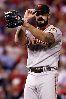 Brian Wilson doing his arm cross gesture (bleacherreport.com)