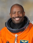 Leland D. Melvin wearing a spacesuit (NASA)