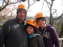 My dad, Avery, and I are ziplining in Tennesse.