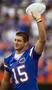 Tim Tebow with his National Championship Trophy (Google images)