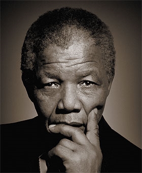 Nelson Mandela looking serious for a photoshoot. (http://jollypeople.com/blog/2009/07/07/nelson-mandela-african-folktales/)