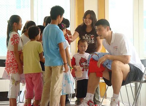 Yao Ming spending time with kids infected with HIV (http://www.yaomingmania.com/blog/2007/07/page/2)