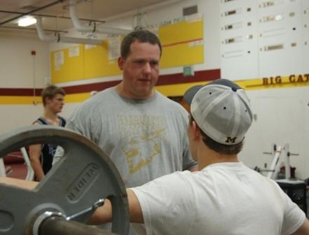 Jody coaching up someone on the hockey team. (Dimond Hockey website)