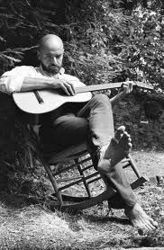 Shel Silverstein Sitting and Playing His Guitar 