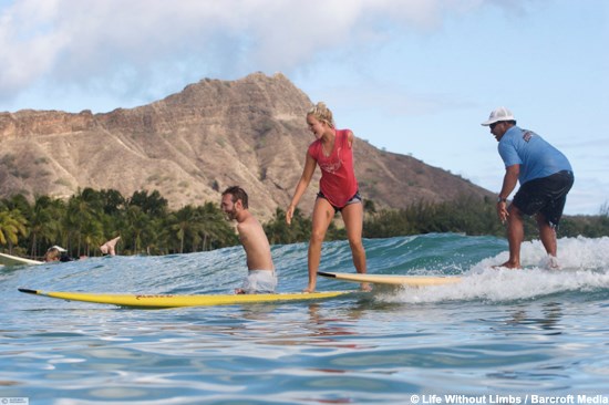 Bethany Hamilton teaching Nick how to surf. (http://andfinally.tv/2009/07/the-amazing-nick-vujicic/)