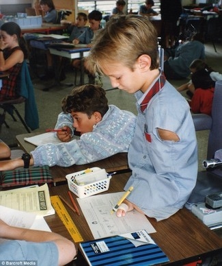 Nick at school writing with his toes. (http://www.dogonews.com/2009/7/31/nick-vujicic-an-extraordinary-human-being)