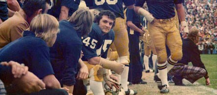 The real Rudy sitting on the bench. #45 (http://www.sportshollywood.com/askrudy.html)
