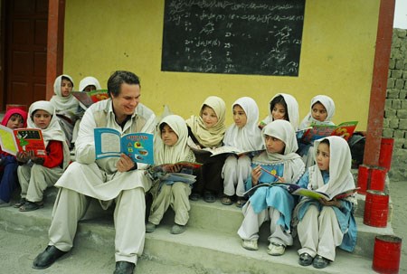 Greg teaching kids to read