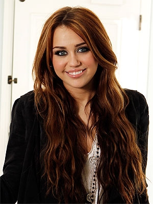 Miley Cyrus posing  (google ())