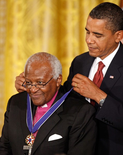 Barack Obama giving an award (Google Images (http://www.zimbio.com))