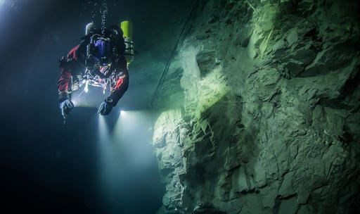 In this underwater photo taken Aug. 21, 2015, in the flooded Hranicka Abyss, Czech Republic, Polish explorer Krzysztof Starnawski is seen examining the limestone crevasse and preparing for a 2016 expedition to measure it depths. On Sept. 27, 2016 Starnawski and his Polish-Czech team discovered that the cave goes 404 meters (1,325 feet) down, making it the world's deepest known flooded abyss. (Krzysztof Starnawski of the Krzysztof Starnawski EXPEDITION via AP)