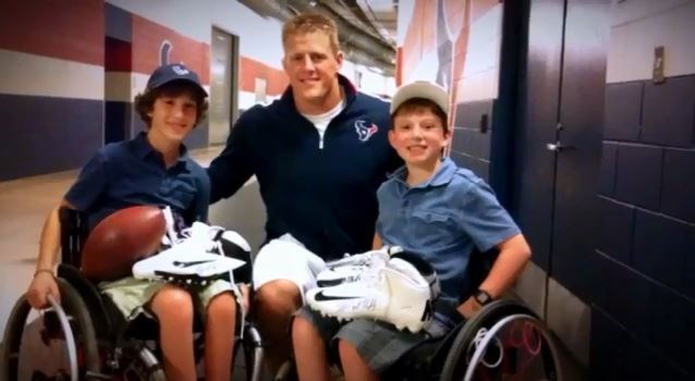 JJ Watt takes a picture with some of his fans (lottimpacttrophy.org ())