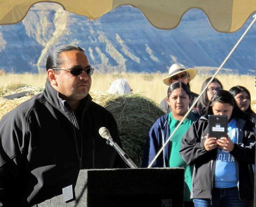 Jason Baldes, coordinator of the buffalo restoration effort for the Eastern Shoshone Tribe, addresses a crowd south of Pilot Butte, Wyo., on the Wind River Indian Reservation Thursday, Nov. 3, 2016. The Eastern Shoshone Tribe released 10 buffalo, marking the first time in more than a century that the animals have roamed the area. (AP Photo/Ben Neary)
