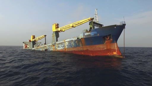 In this Jan. 20, 2017 photo provided by the Texas Parks and Wildlife Department, a former cargo vessel named Kraken sinks more than 60 miles off the coast of Galveston, Texas, to become an artificial reef. The ship is expected to become a home to fish, coral and other invertebrates plus being a destination for divers. (Texas Parks and Wildlife Department via AP)