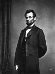 Abraham Lincoln posing for a picture