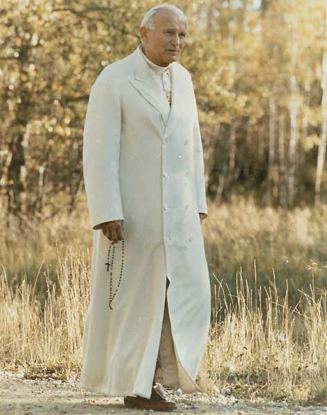 This is Karol walking, carrying his rosary (http://religion-cults.com/pope/gallery.htm)