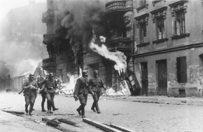 A block of houses burning in the Warsaw Ghetto (www.holocasutsurvivors.org)