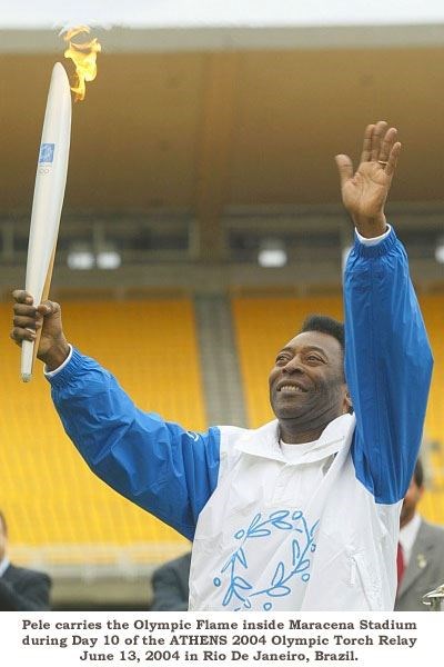 Pele carrying the Olympic Torch (360Soccer)