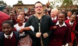 <a href=http://images.scotsman.com/2006/05/17/2006-05-17T190146Z_01_NOOTR_RTRIDSP_2_OUKEN-UK-AFRICA-BONO-AIDS.jpg>Bono in Africa</a href>