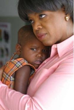 <a href=http://www.international-womens-month.co.uk/articles/oprah_winfrey.html>Oprah and young African child </a>