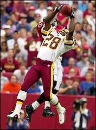 Darrell Green leaping for a catch 