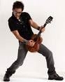 <a href=http://www.ocregister.com/newsimages/show/2006/04/0419ukulele.jpg>Jake Shimabukuro </a>showing off his skills