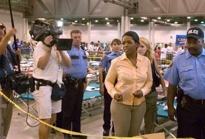 <a href=http://www.katrinadestruction.com/images/d/6096-4/oprah+photo>Oprah </a> visits evacuees in New Orleans