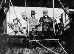 The brothers sitting in one of their planes (Google)